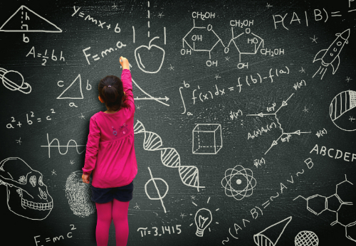 little-girl-writing-on-blackboard.jpg