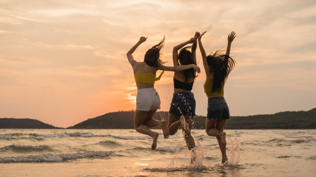 group-of-three-asian-young-women-jumping-on-beach_7861-1855.jpg